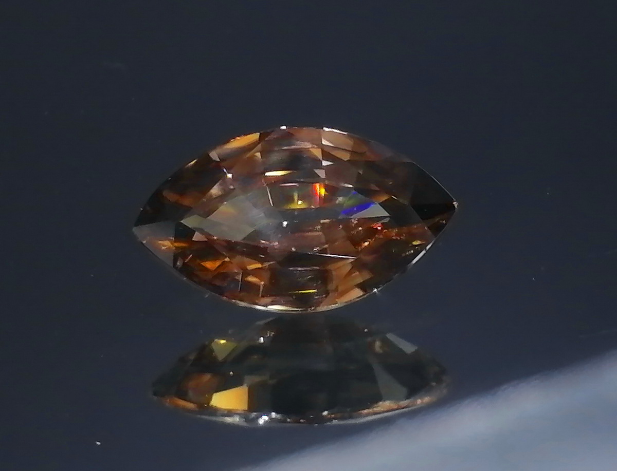 Marquise cut affordable 4 carats untreated orangish beige shiny natural Zircon from Pailin Cambodia. 