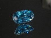 Pill shaped blue Zircon cushion - pretty wide while shallow, best value affordable zircon gem with sky blue C+ to B- color grade. 