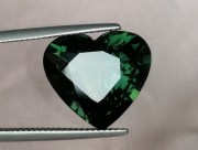 14.25 carats heart shape green sapphire nicely cut and perfectly clean. 