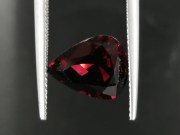 Deep burgundy red to purple Garnet cut in wide pear drop for a pendant. 