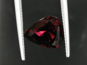 Deep burgundy red to purple Garnet cut in wide pear drop for a pendant. 