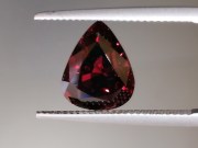 Deep burgundy red to purple Garnet cut in wide pear drop for a pendant. 