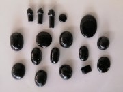 Tektite cabochons and religious penis carvings from the Tonlé Sap meteorite impact in Cambodia. 