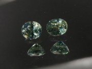 Pair of natural blue green yellow Zircon oval calibrated at 6mm by 8mm from Cambodia