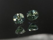 Pair of natural blue green yellow Zircon oval calibrated at 6mm by 8mm from Cambodia