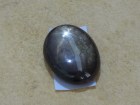 Black Star Sapphire in oval shape cabochon. 