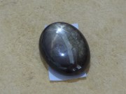 Black Star Sapphire in oval shape cabochon. 