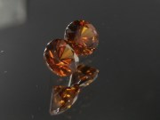 6.5mm wide calibrated pair of Hyacinth deep reddish orange natural zircon cut in round brilliant shape for earrings or studs jewelry