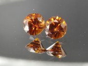 6.5mm wide calibrated pair of Hyacinth deep reddish orange natural zircon cut in round brilliant shape for earrings or studs jewelry