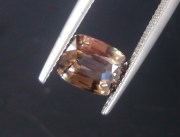 affordable and cheap 3 carats unheated orangish beige cushion shiny natural Zircon from Pailin Cambodia. 