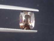 affordable and cheap 3 carats unheated orangish beige cushion shiny natural Zircon from Pailin Cambodia. 