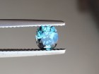 Green oval sapphire with dashes of blue, very clean and shiny small sapphire from Thailand. 