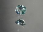 Green oval sapphire with dashes of blue, very clean and shiny small sapphire from Thailand. 