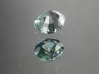 Green oval sapphire with dashes of blue, very clean and shiny small sapphire from Thailand. 