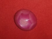 Star Ruby cabochon pink and red with typical corundum crystal pattern