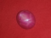 Star Ruby cabochon pink and red with typical corundum crystal pattern