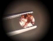 Precision 6.5mm brilliant cut orange to salmon zircon, perfectly cut from professional lapidary. 