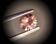 Precision 6.5mm brilliant cut orange to salmon zircon, perfectly cut from professional lapidary. 