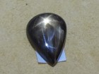 Black Star Sapphire in pear shape cabochon. 